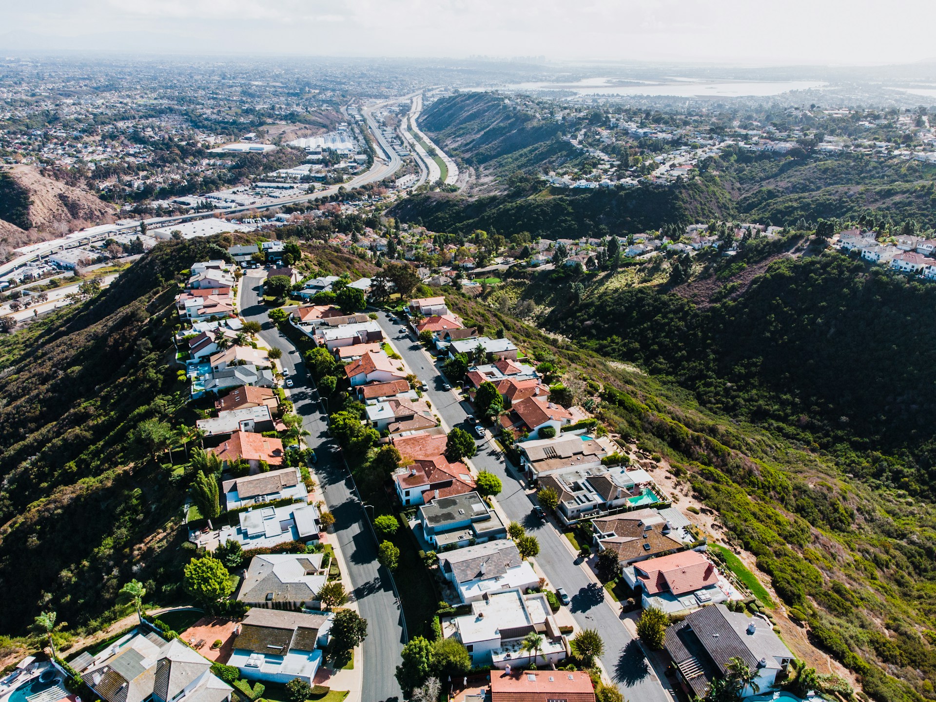 Aerial view of a hillside residential neighborhood of short-term rental homes