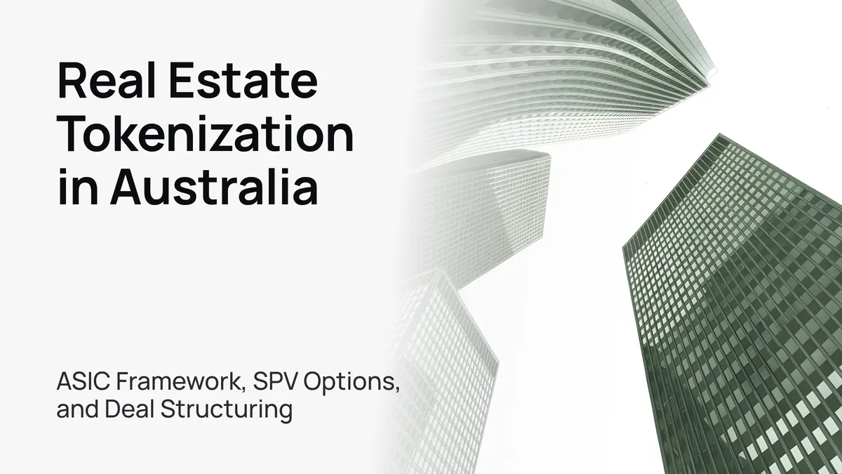 A modern glass skyscraper against a clear blue sky, symbolizing real estate tokenization.