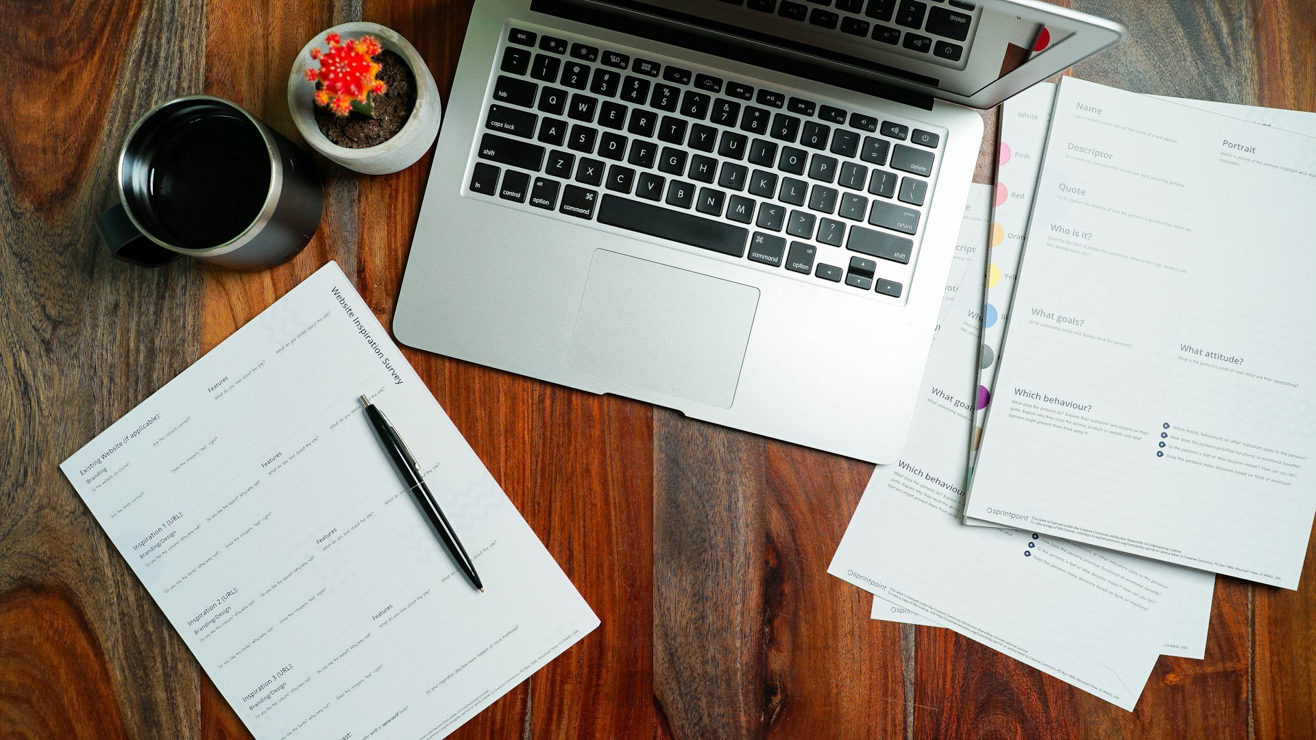 Close-up of legal documents and a pen on a wooden desk.