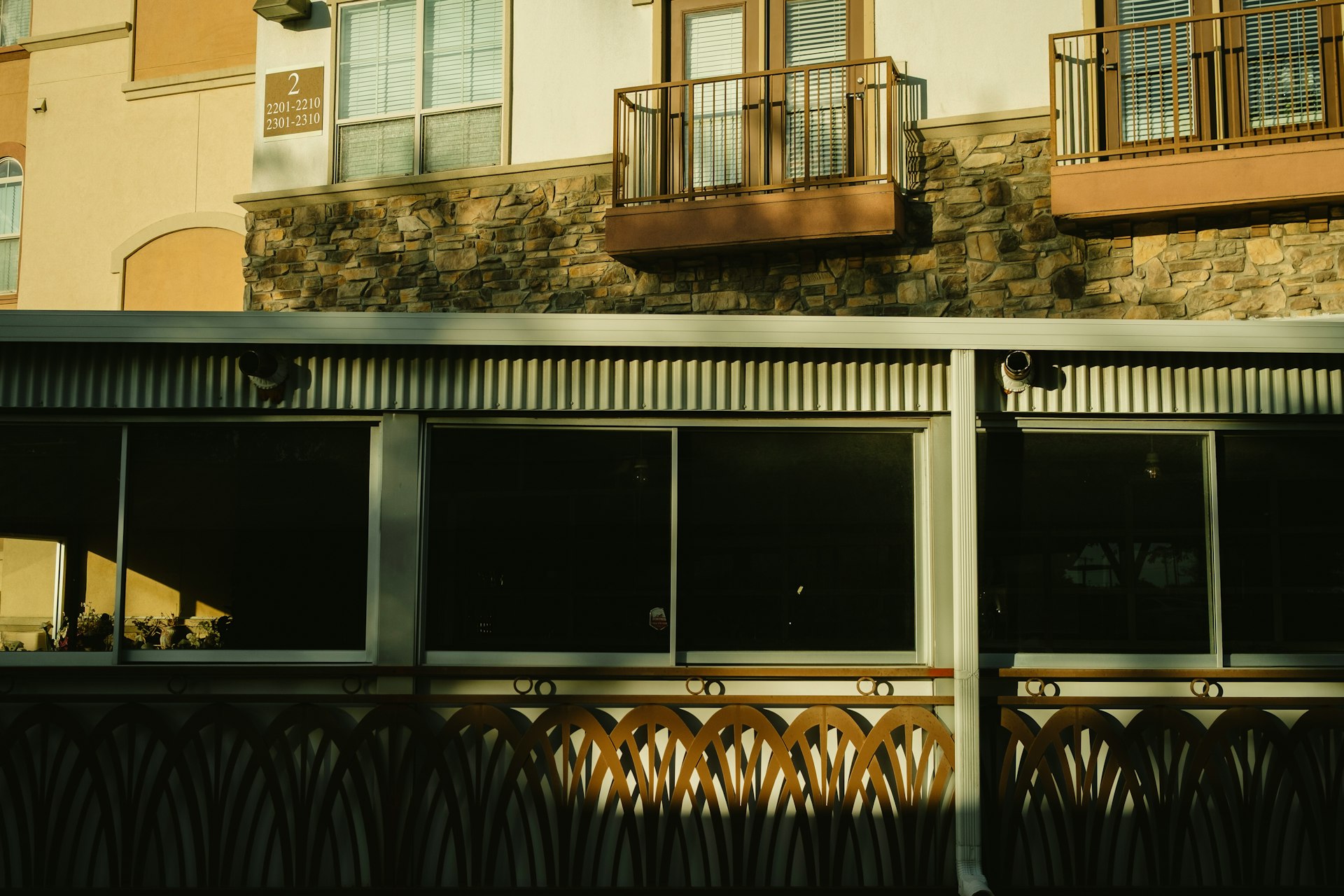 Exterior of a modern residential apartment building, illustrating stabilized residential properties.