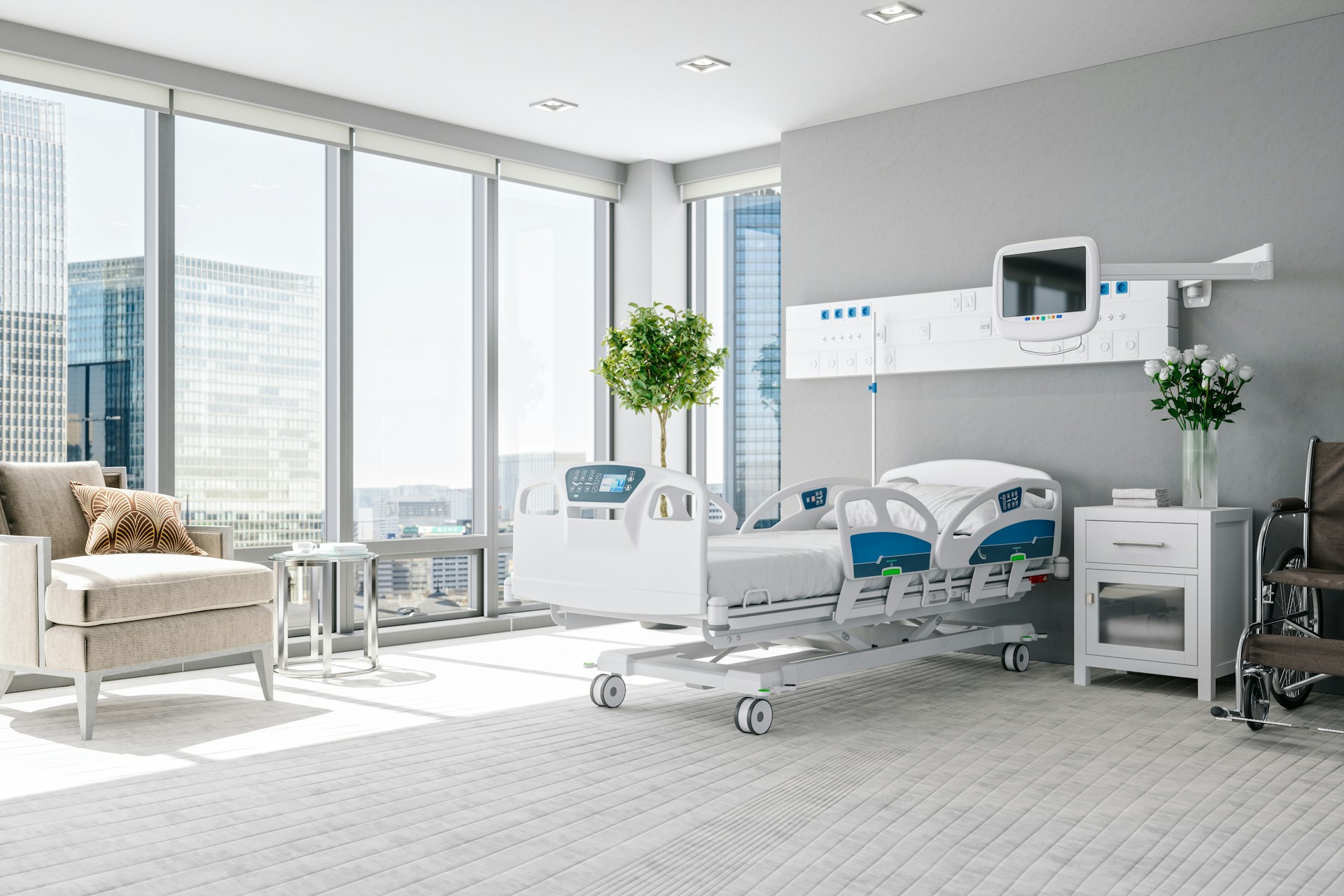 Modern hospital patient room with a medical bed and city view