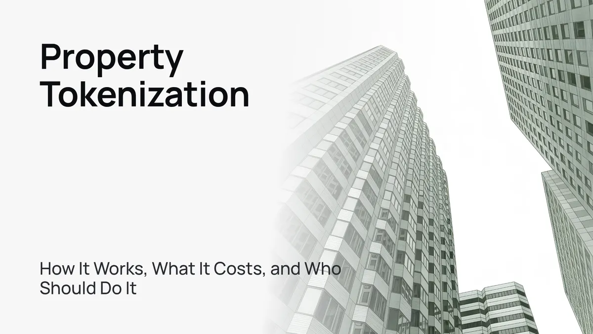 Modern glass skyscraper against a clear blue sky, symbolizing real estate tokenization.