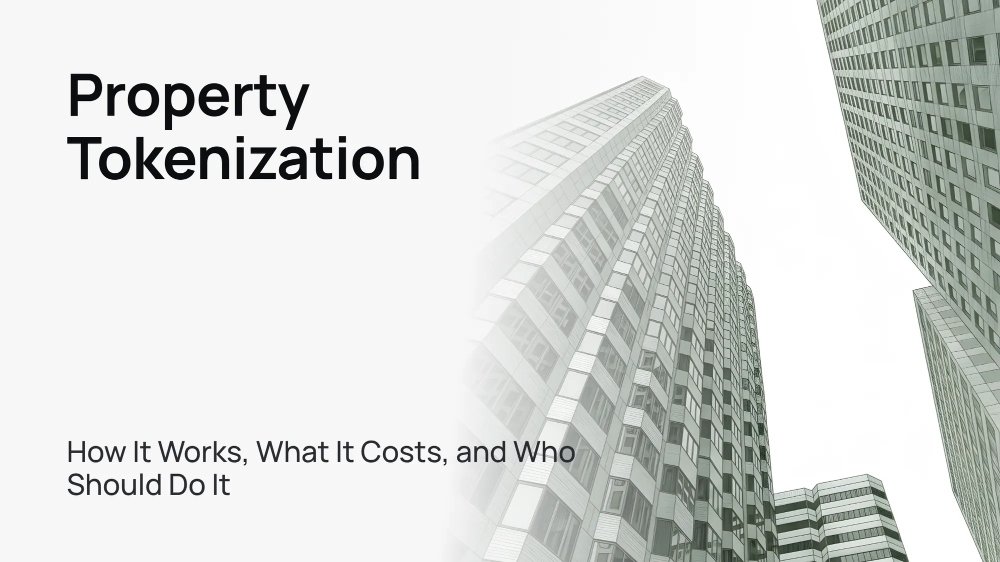 Modern glass skyscraper against a clear blue sky, symbolizing real estate tokenization.