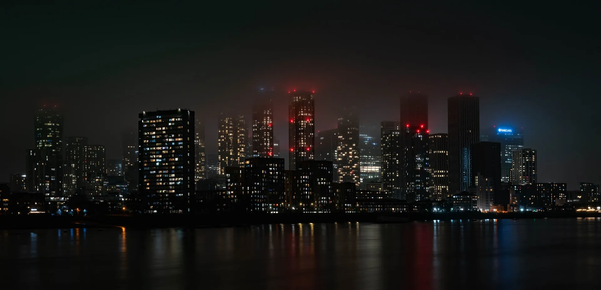 City skyline at night with skyscrapers