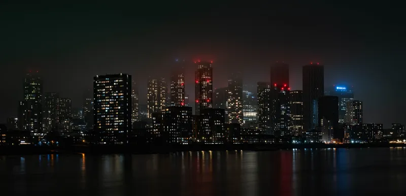 City skyline at night with skyscrapers