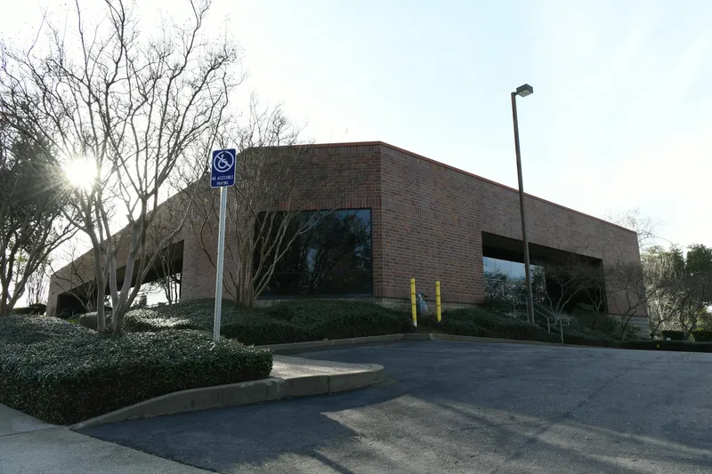 Modern office building under bright sky