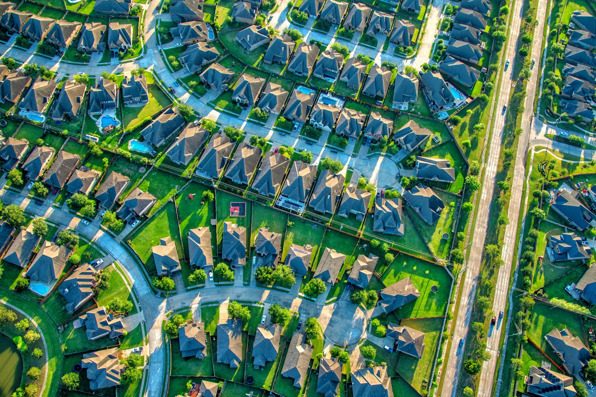 Aerial view of a suburban residential neighborhood of single-family homes