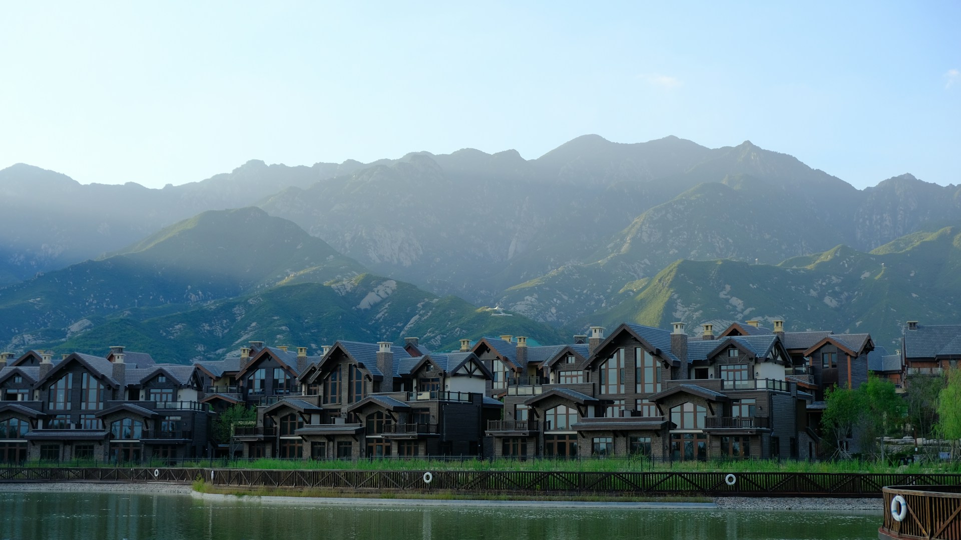 Waterfront vacation rental townhouses below a mountain range