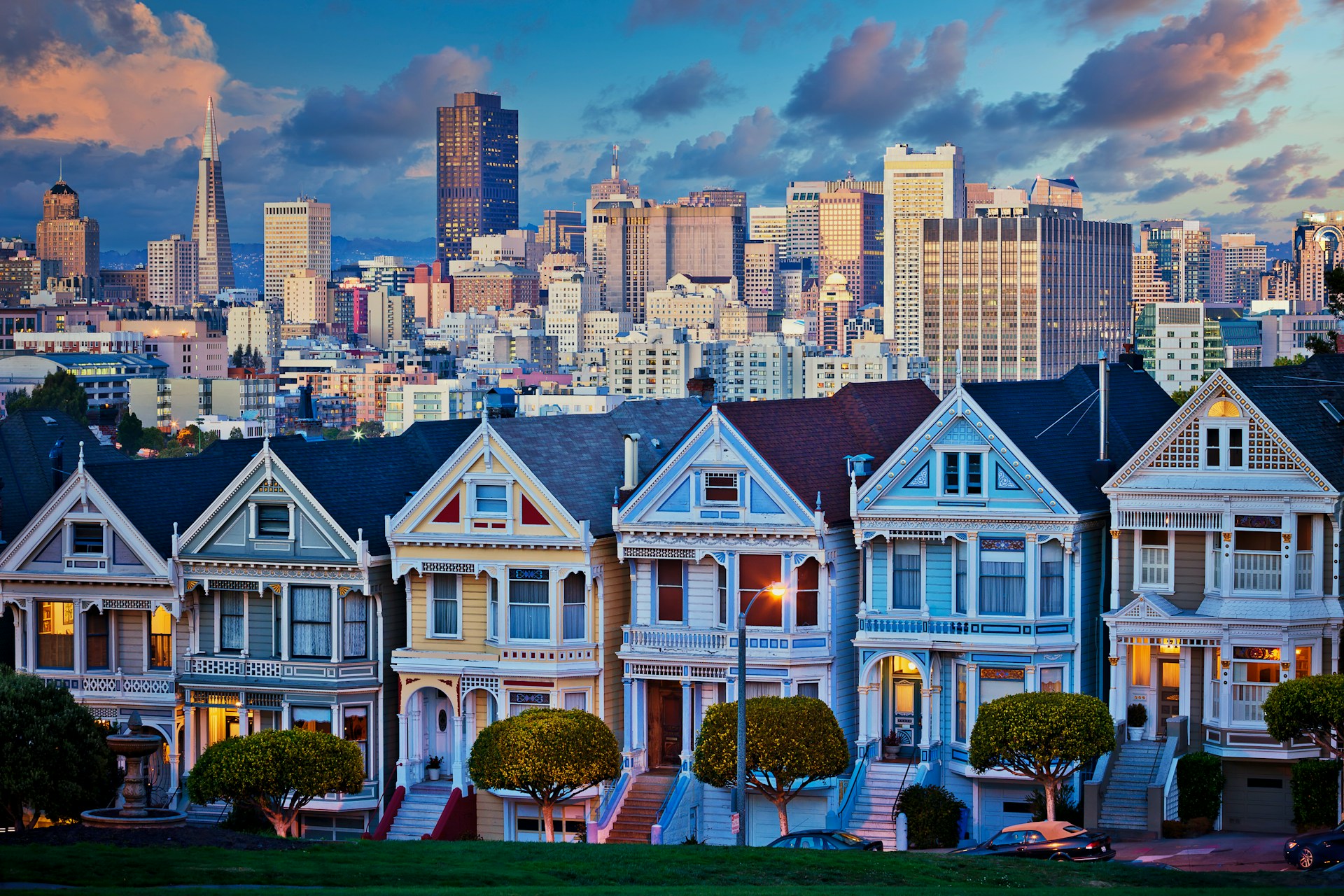 Row of residential homes against a city financial-district skyline