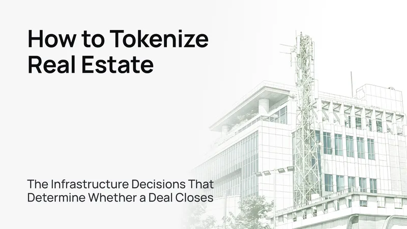 Modern glass office tower against a clear blue sky, symbolizing real estate tokenization infrastructure.