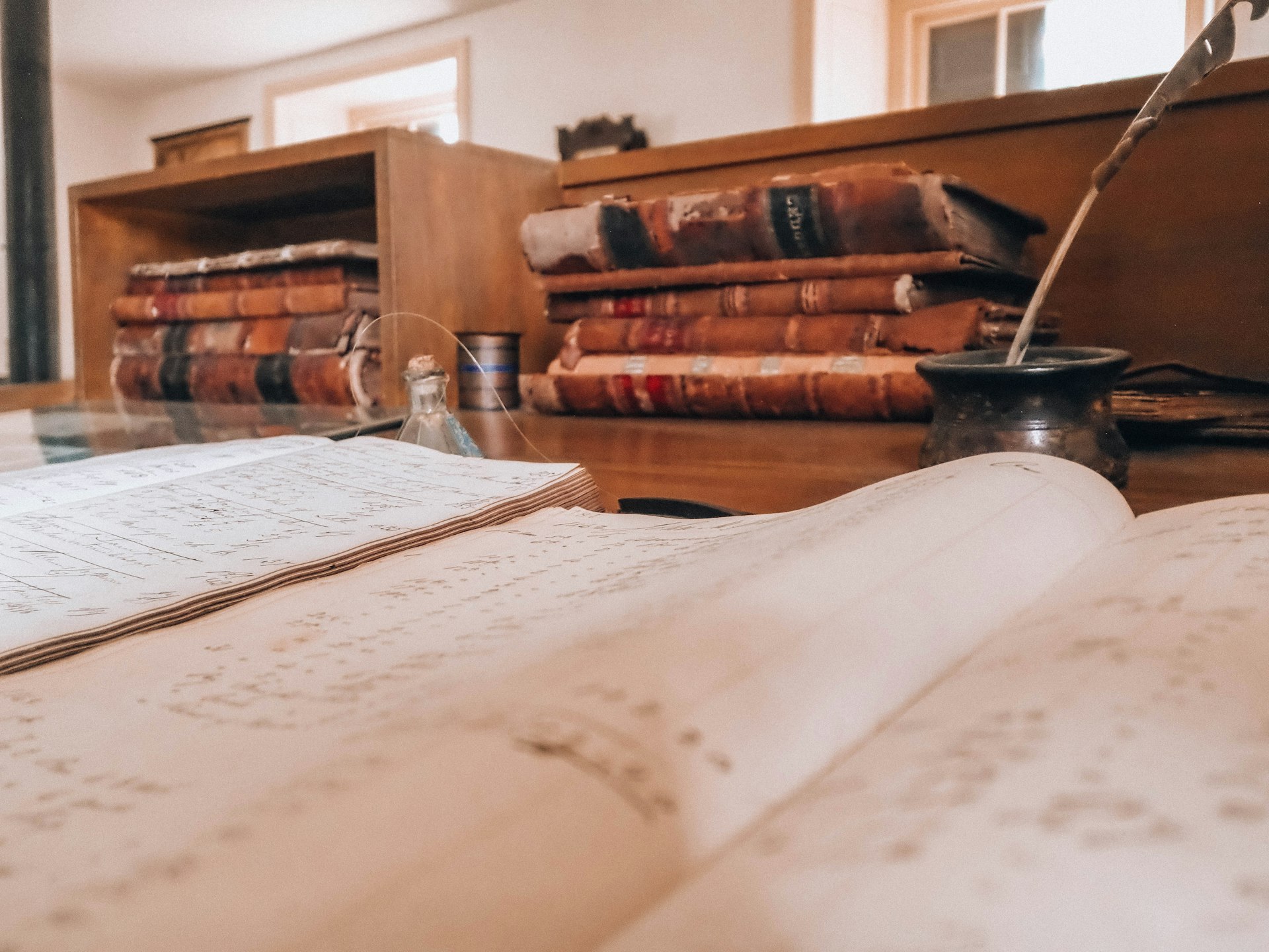 Stack of legal documents on a desk, representing legal wrapper selection for property tokenization.