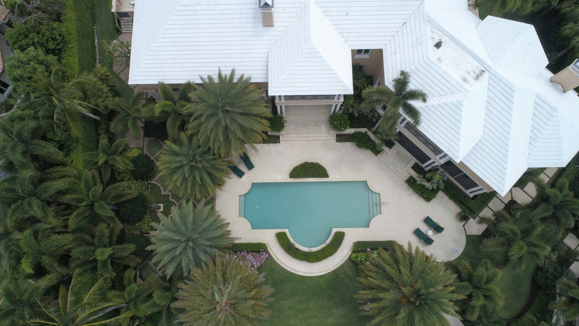 Aerial view photography of white house near swimming pool