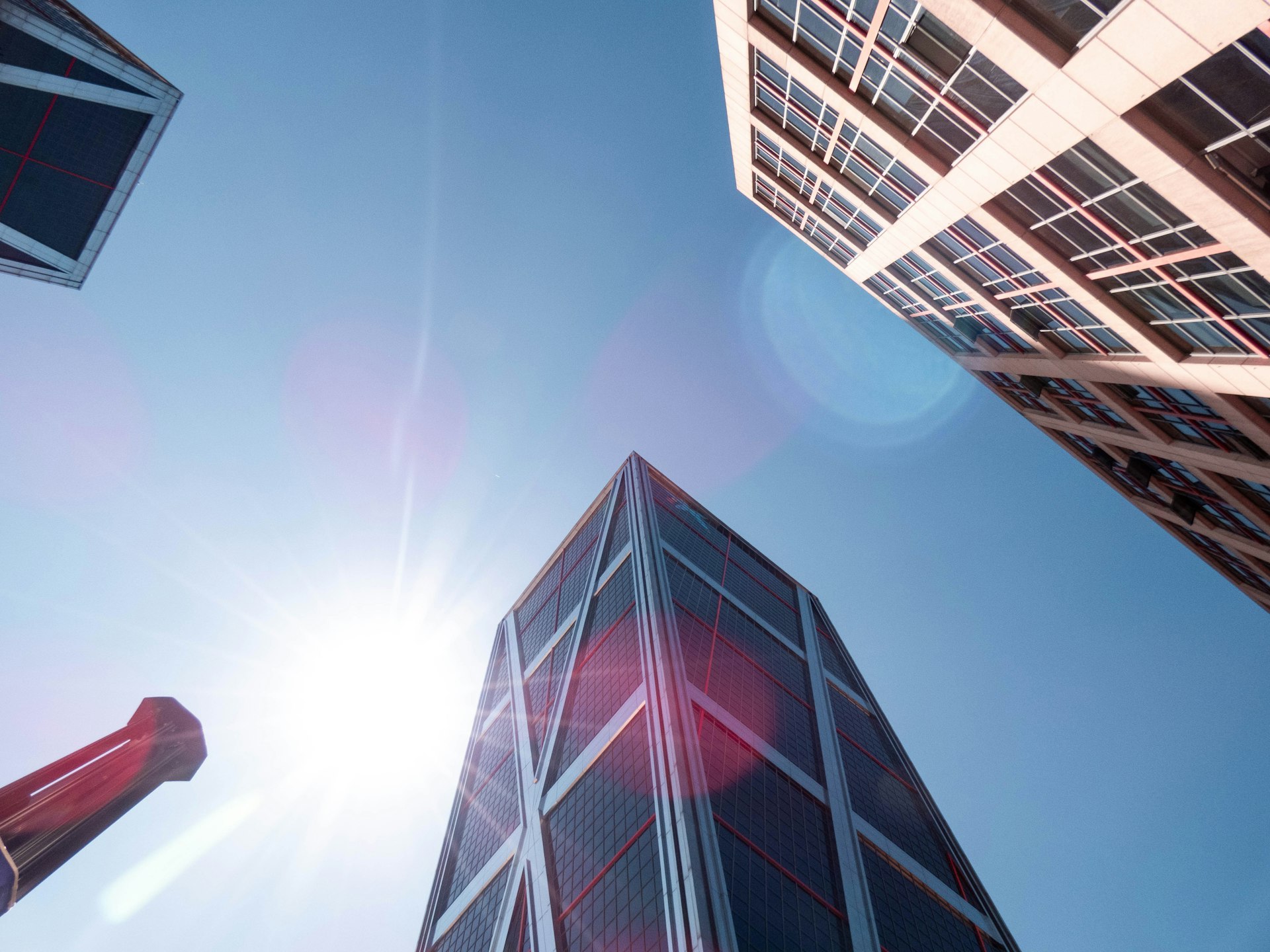 Modern skyscraper against blue sky