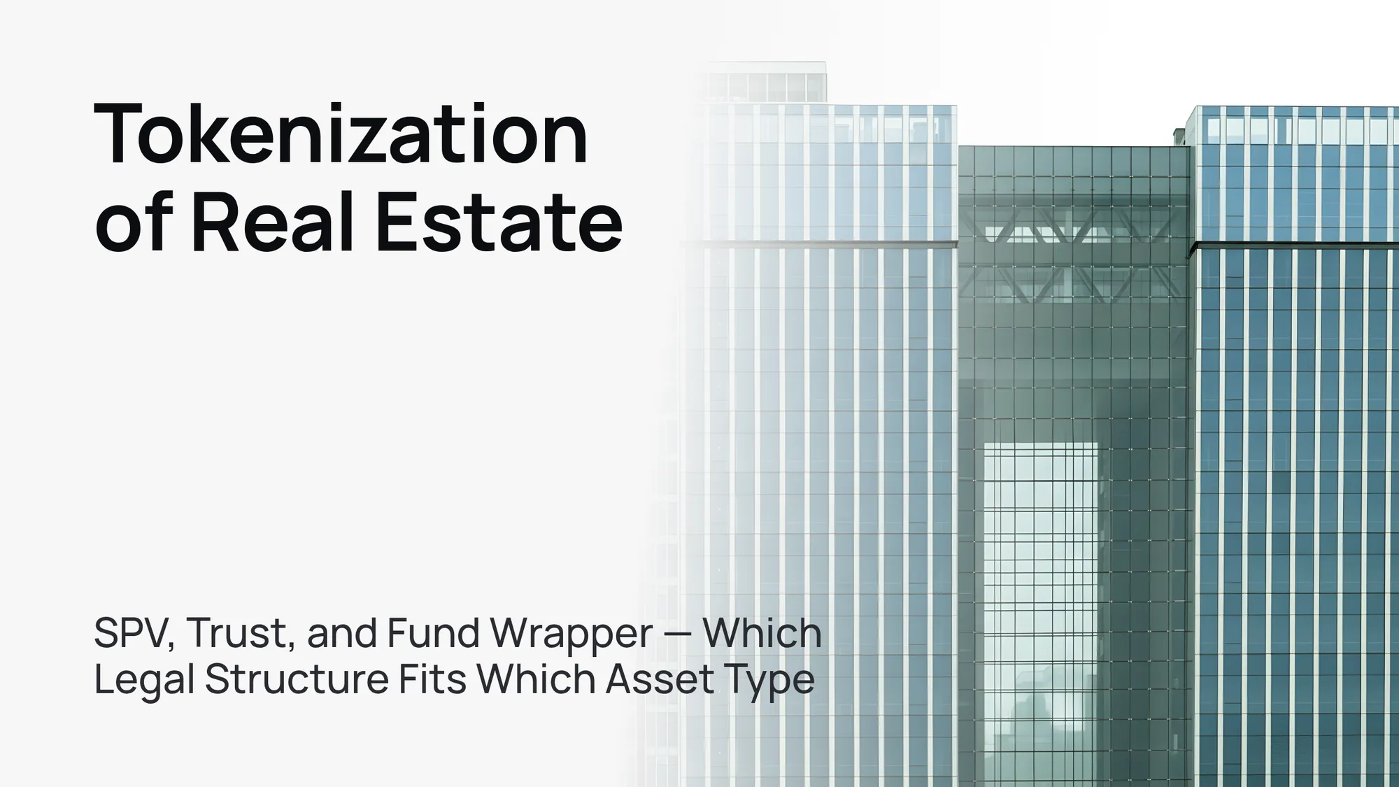 A modern glass skyscraper against a clear blue sky, symbolizing real estate tokenization.