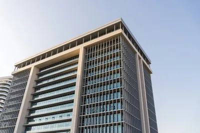 Modern office building under bright sky