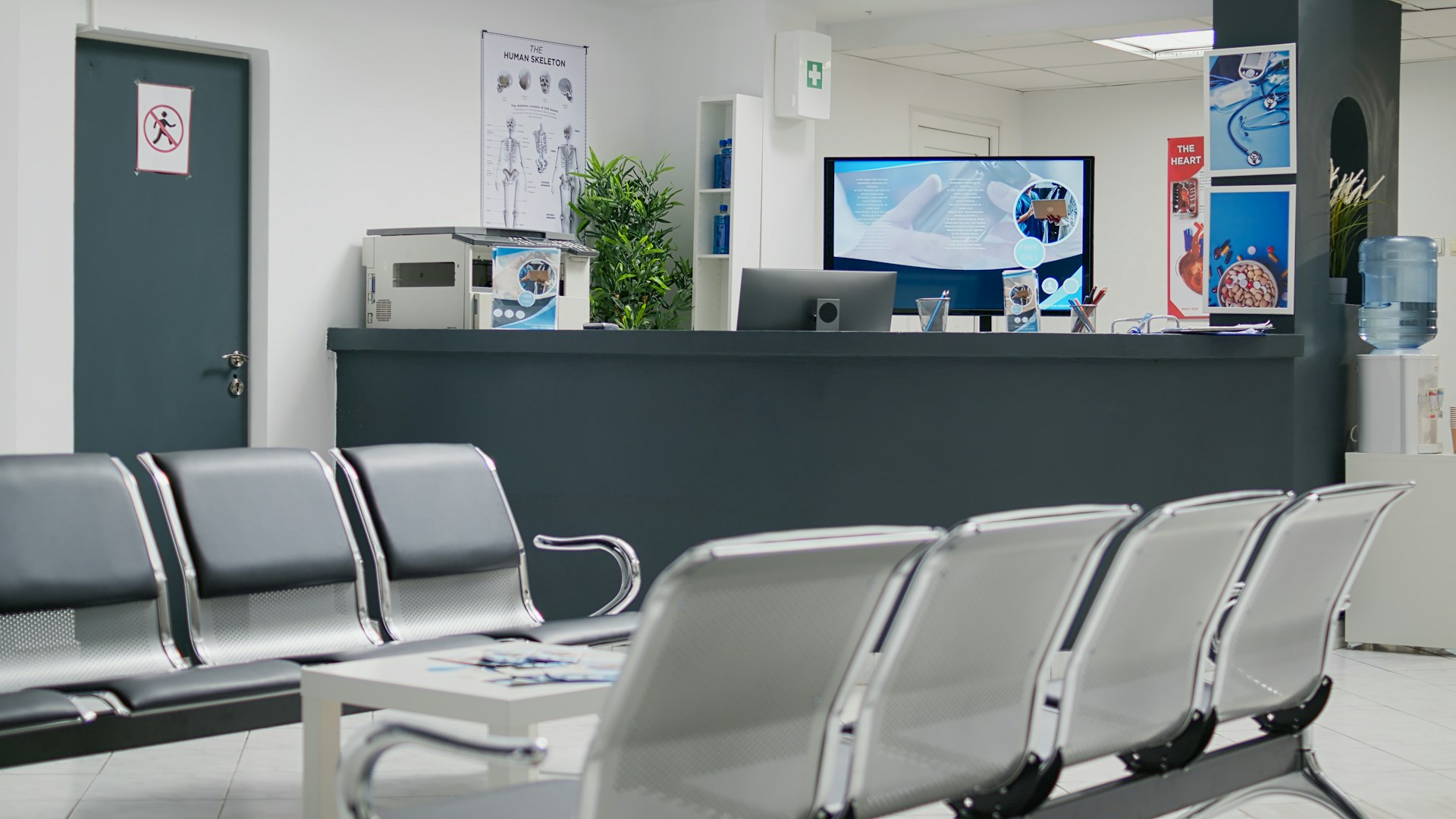 Empty waiting room of a medical clinic with reception desk
