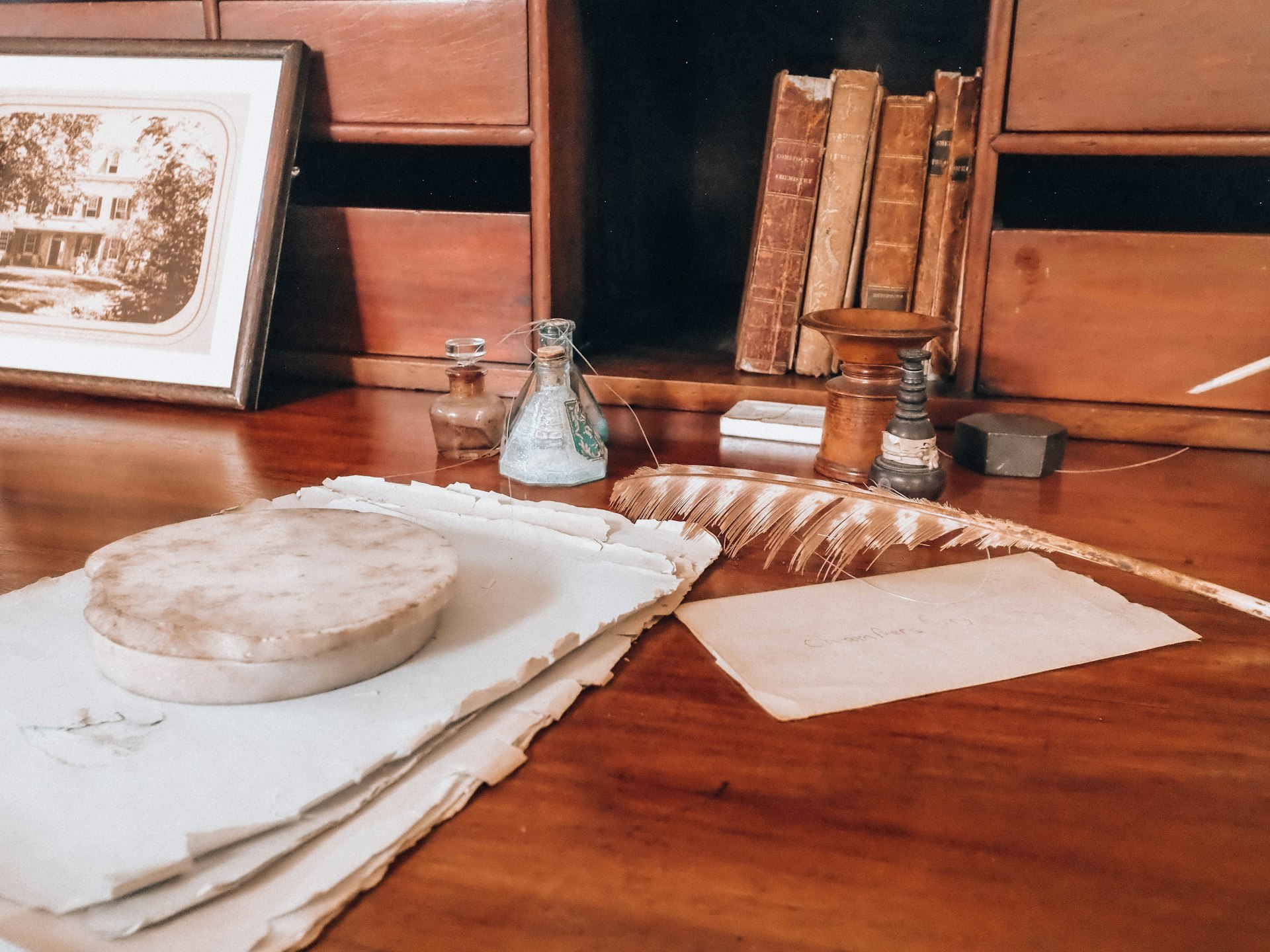 Stack of legal documents and a pen on a wooden desk.